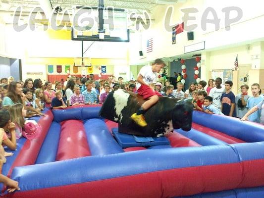 Kids riding Mechanical Bull