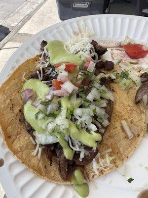 Taco added black beans cheese pick de gallo onion and green avocado salsa...missing in photo: the corona