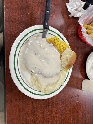 Country fried steak with mashed potatoes and corn