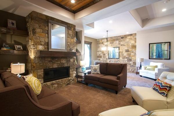 This is a basement?  A walk-out features high, tray ceilings, stone fireplace surround and stone wall bringing main floor liv...