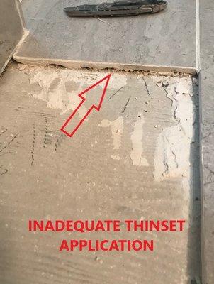 Inadequate thinset under tiles