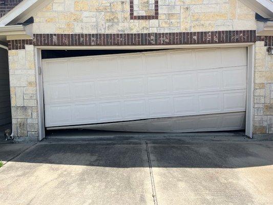 This hung door was caused by a snapped cable.