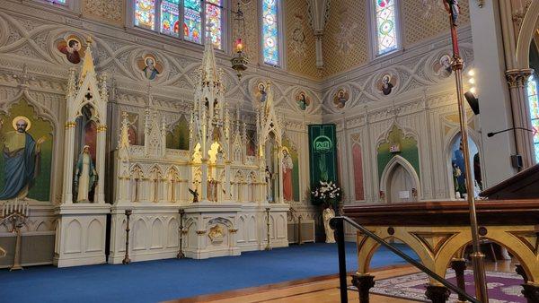 The old altar (the white thing with the statues at either end) is designed to look like a small church.