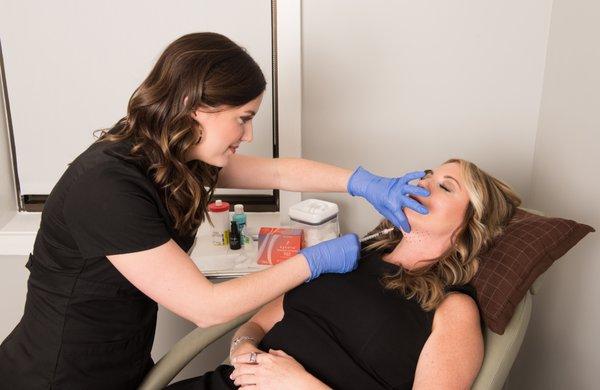 Megan Spivey, RN, BSN, helping her client gain a more defined jaw line with Kybella™