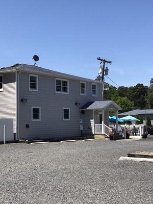 Back of restaurant, patio & parking lot