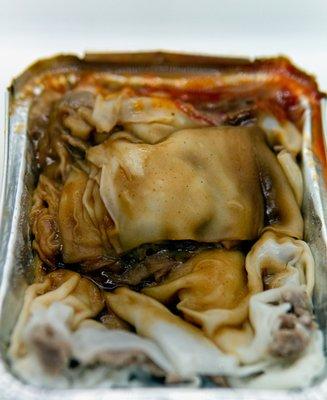 Beef Rice Noodle Roll (牛肉肠粉), with soy sauce, peanut sauce, and hot sauce. Take-out.