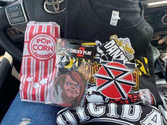 Stickers, shirts, pins, and an air freshener