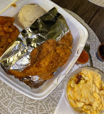 Fried chicken tenders with sides.