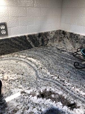 Great example of workmanship showing how granite flows into back splash.