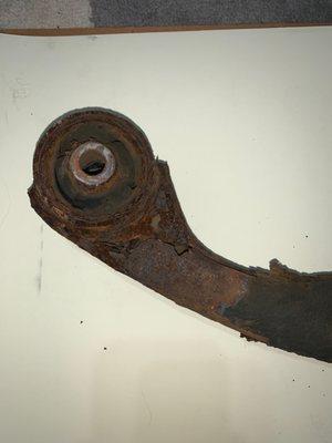 Corroded left lower control arm