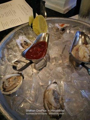 Have a dozen blue point oysters. Fresh and flavorful. And a Tito's martini with a twist.