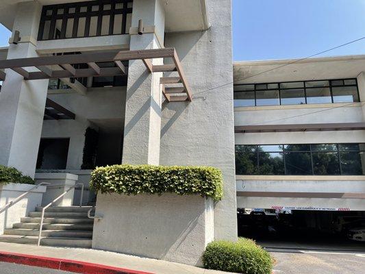 The clinic is located just up these stairs and past the main entrance doors, to the right.