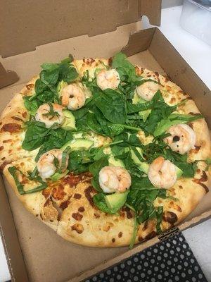 Avocado, shrimp on the bed of Greens