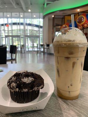 A double chocolate muffin with an iced latte