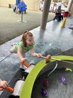 My kiddo playing in the water activity outside