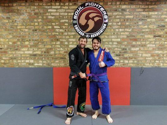 Our student being promoted to Purple belt!