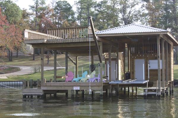 Typical One and half boathouse with metal roof and upper sundeck