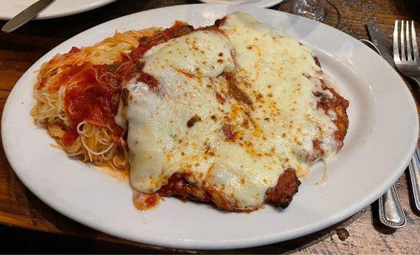 Veal Parmesan with angel hair pasta.