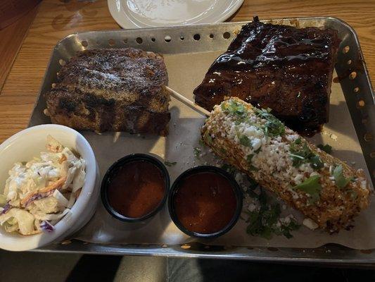 Full Rack of Ribs dry rub on left and honey habanero on right with coleslaw and street corn.