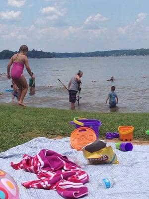 Me. Metal searching for beer caps and broken promises while the kids swim in murky waters of Lake Wylie