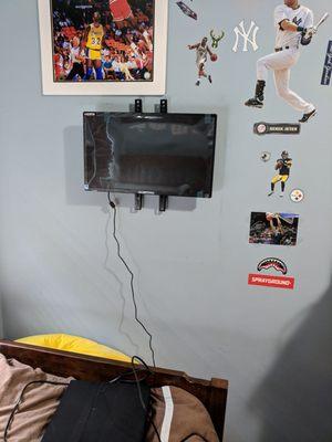 Small TV on my sons bedroom wall