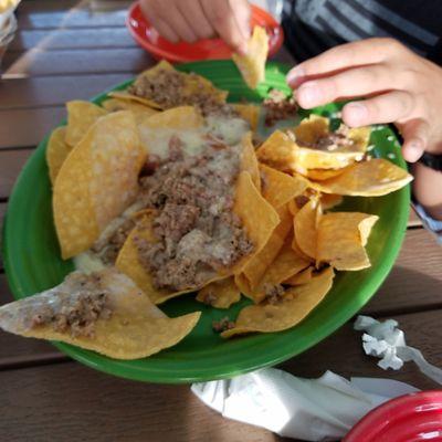 Beef nachos.  Plain, greasy ground beef with a bit of cheese.  No lettuce,  tomatoes,  hot sauce,  nothing.  Pretty blah!