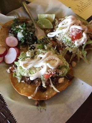 My counterpart ordered 2 carne tostadas, drizzled with sour cream. They looked amazing.