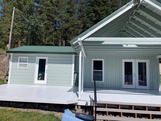 Exterior paint, replaced all three doors, added a new window and refinishing the deck on this charming lake house!