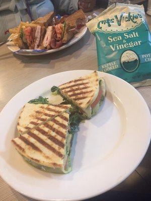 Vegetable Pesto Panini & Turkey Club in background