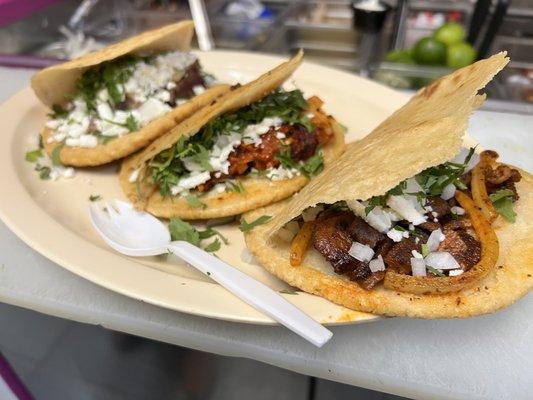 Gorditas , de Pastor (Marinated Pork) , Chicharrón, con queso fresco, cilantro y cebolla.