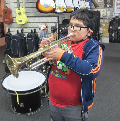 Our 'Play It Forward' program donates instruments into the hands of folks who otherwise could not afford a musical instrument.