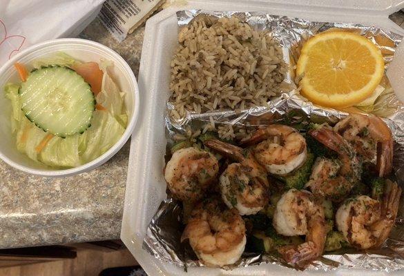 Grilled jumbo shrimp with dirty rice, grilled veggies and salad