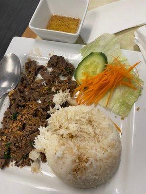 Grilled beef with rice and a mini salad.