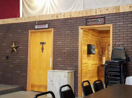 The UW Wanderoos Outback Saloon bathroom entrances, labelled Cowgirls and Cowboys.