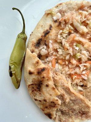 Carnitas, beans, and cheese pupusa. Comes with a jalapeño which is hot!