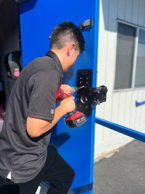 FlyLock Orange County security specialist installing commercial door hardware