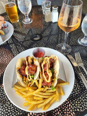 General Tso's chicken with French fries dusted with Rosemary. Glass of Rose.