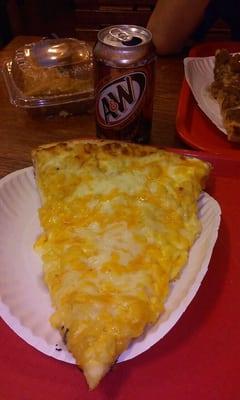 Nummy macaroni and cheese pizza with a root beer and baklava for desert.