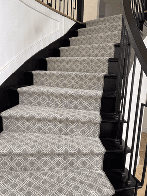 Design carpet on steps bind on both sides designed and installed By Aladdin Carpet & Floors