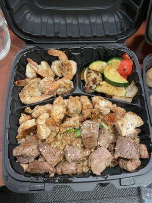 Three of a Kind: Chicken, Shrimp and Filet Mignon with fried rice and veggies.