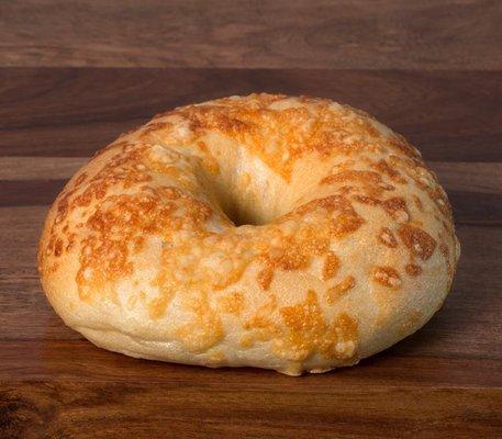 Freshly baked bagel topped with asiago cheese.