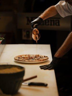 Pizzaiolo making a delicious pizza