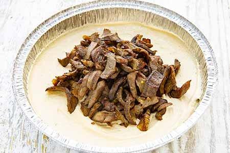 Beef over hummus