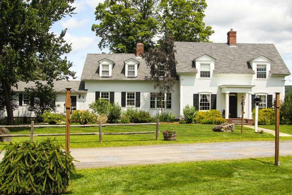 a view of the 1824 House during the summer. Photo by Maine Mountain Media