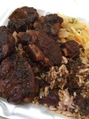 Small plate of oxtails, rice and beans, and stewed cabbage. $13