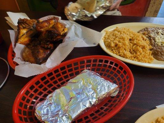 1/2 marinated chicken, refried beans  and rice,  tortillas.