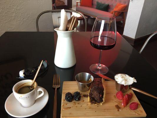 Chocolate tamale with caramel, whip cream and mixed berries, a double expresso, and glass of Pinot Noir wine.