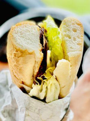 Hubby's Cajun Roast beef po'boy "dressed" Lettuce tomato with Remoulade & Swiss cheese.