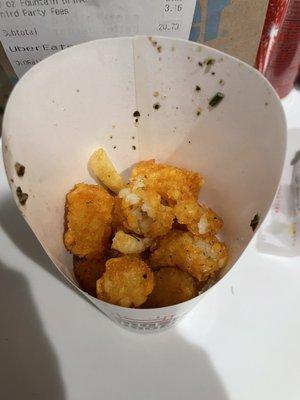 Cold tots, couple fries for good faith. Half empty.