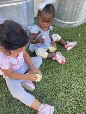 Enjoying our popcorn from the Village store!